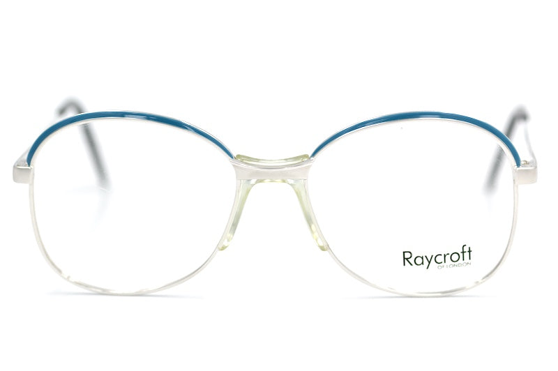 Anita Raycroft women's 70s vintage glasses. Silver metal frames with blue trim.