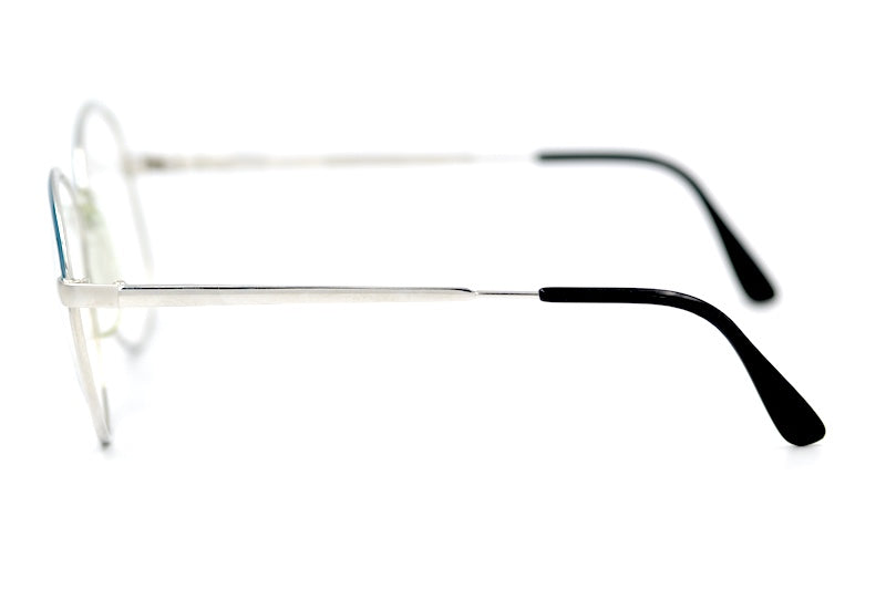 Anita Raycroft women's 70s vintage glasses. Silver metal frames with blue trim.