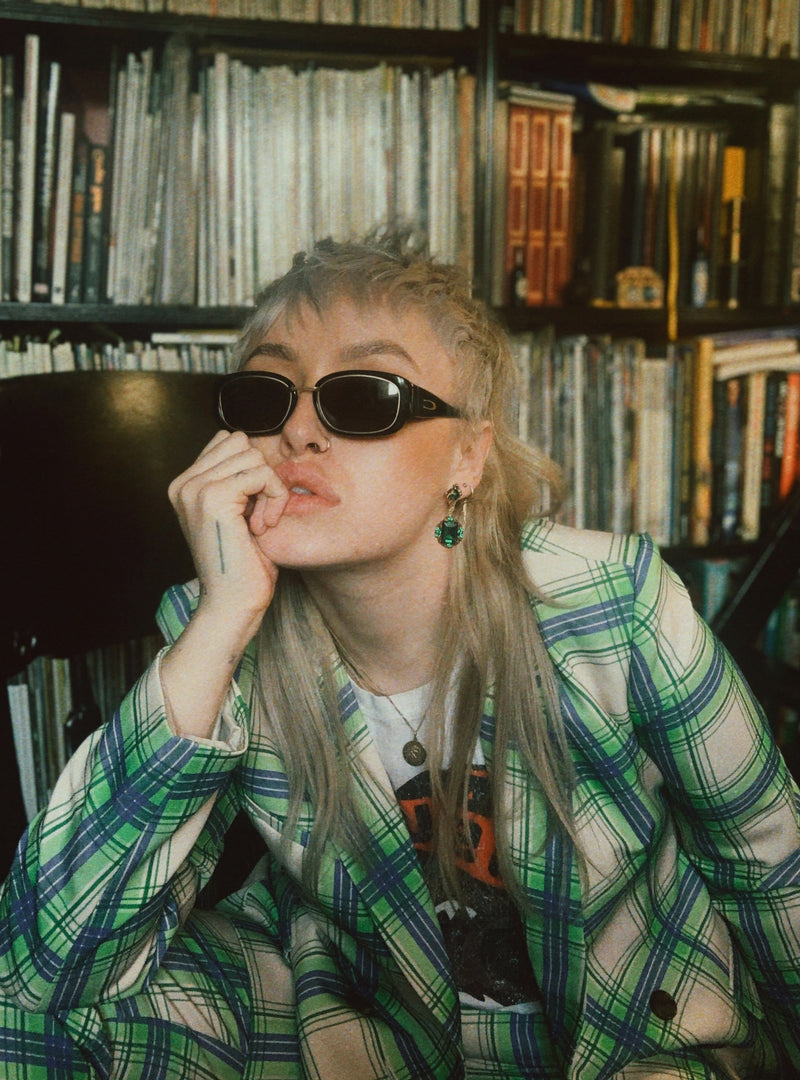 Model wearing Cerruti 1881 4205 A Vintage Sunglasses in a green plaid suit.