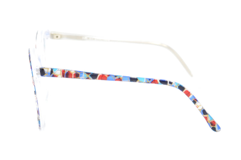  New old stock Zoe by Brulimar in colour 2297. Autumnal in colour this acetate frame features white, gold, red and brown mottling. A real warm frame, this 1980's oversized vintage frame is super stylish and available in a variety of colours.